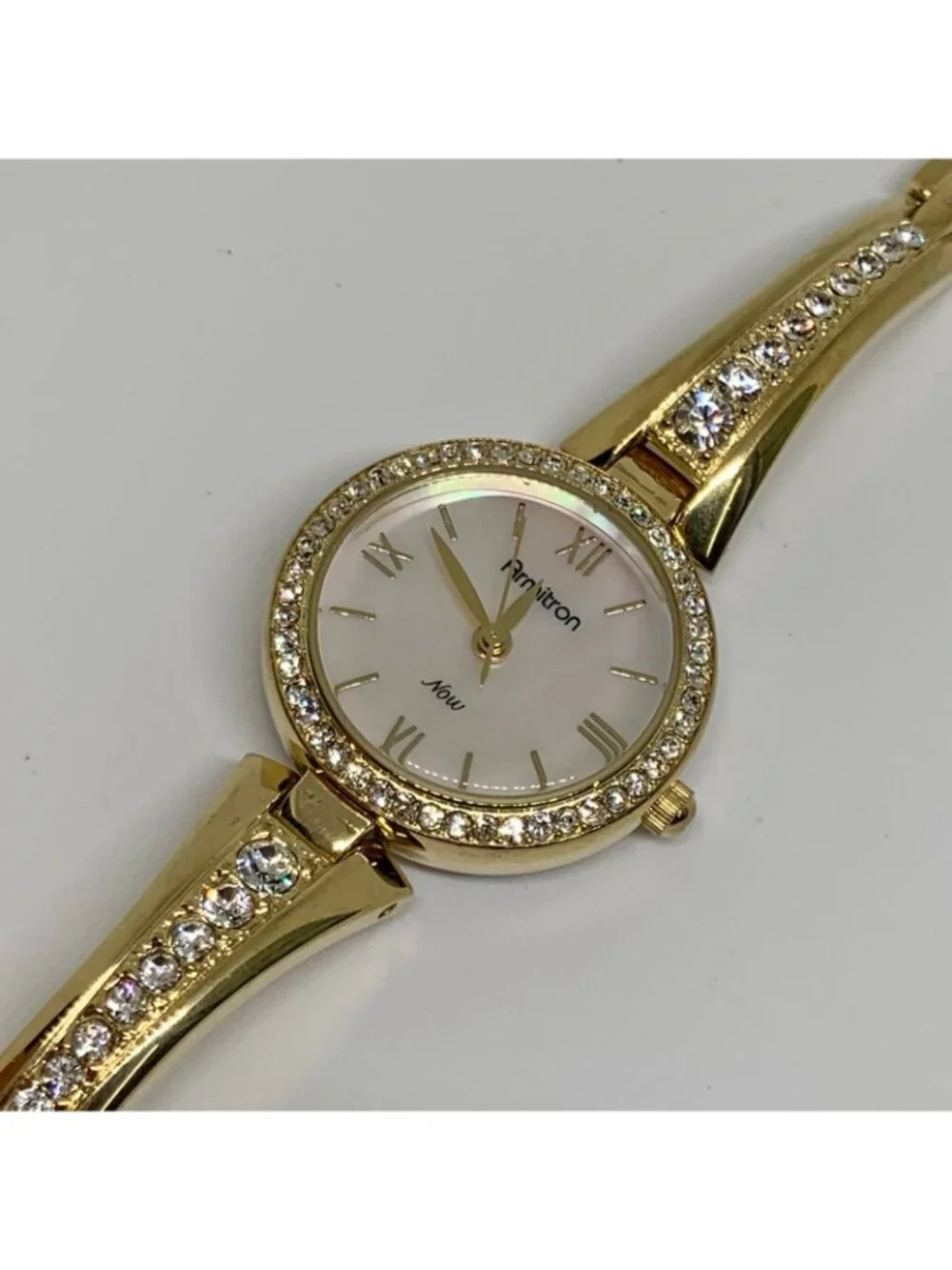 Armitron women’s watch gold tone 24mm mop dial quartz rhinestones running